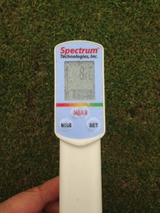 Soil temperature probe showing 8 degrees C at 3 cm